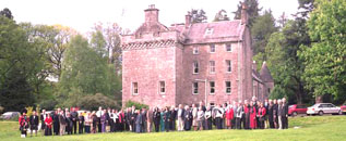 Culcreuch Castle, ancestral Home of the Galbraiths. The people in front of the castle are some of "us" at the 2002 Clan Galbraith Gathering.